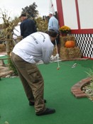 Pat lining up and finishing out a sweet ace on the first hole